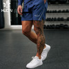 HUCAI OEM Mens Sports Shorts Hidden Zipper Pocket split Hem Custom Activewear Manufacturers